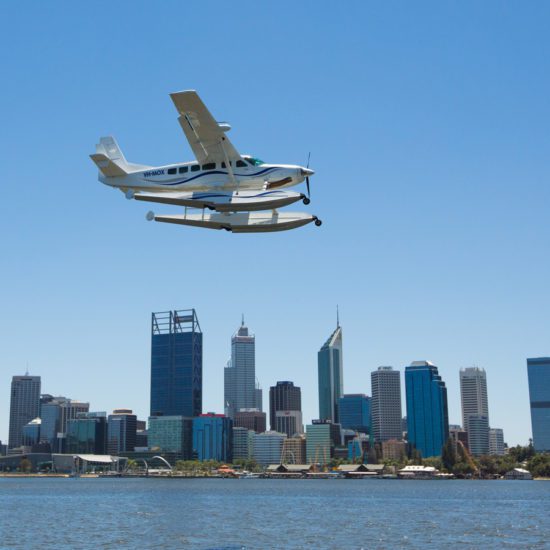 Cessna 208 over Perth City